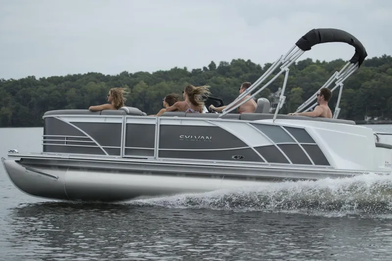 Slide: The Image of Manufacturer Provided Image: 2020 Sylvan S3 CRS pontoon boat cruising on a lake with passengers. - 16