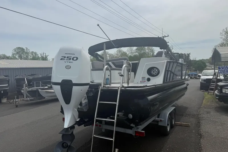 Slide: The Image of 2020 Sylvan S3 CRS pontoon boat with Honda 250 VTEC engine on trailer. - 2