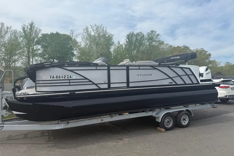Slide: The Image of 2020 Sylvan S3 CRS pontoon boat on trailer, parked outdoors. - 3