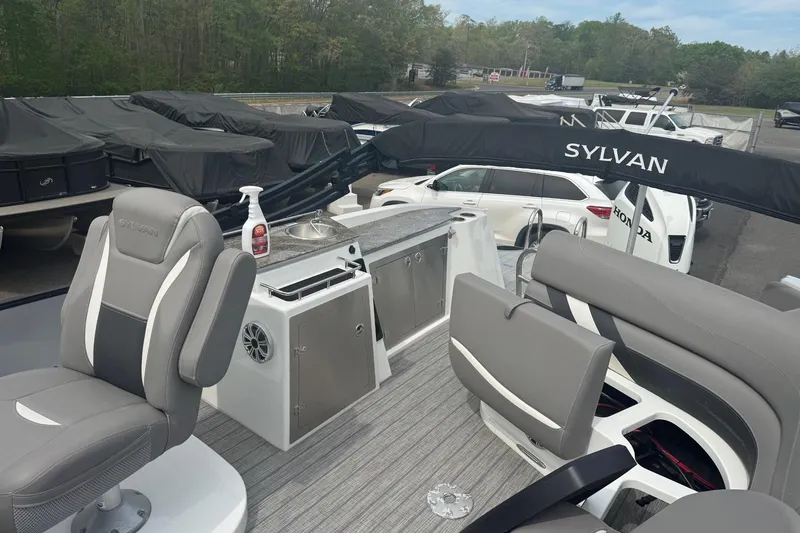 Slide: The Image of 2020 Sylvan S3 CRS boat interior with seating, sink, and storage compartments. - 5