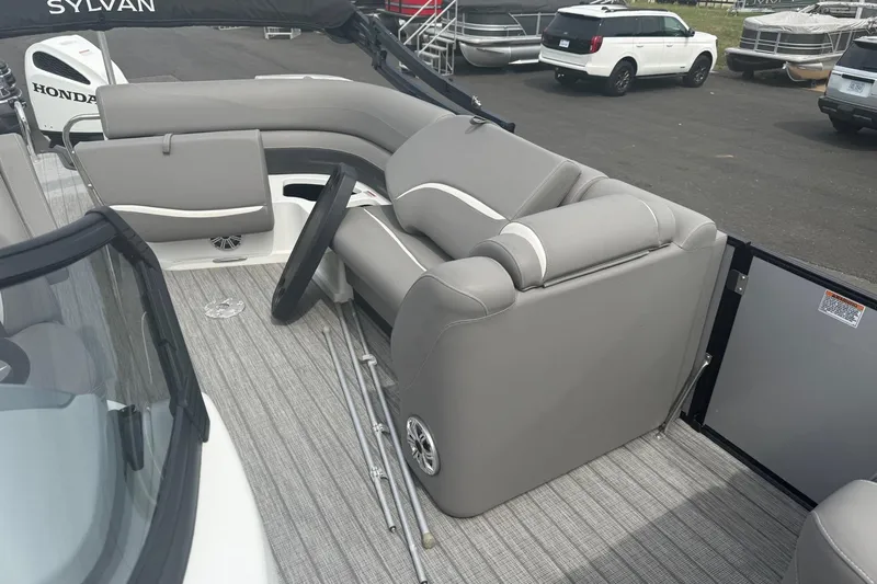 Slide: The Image of Interior of 2020 Sylvan S3 CRS boat with gray seating and steering wheel. - 8