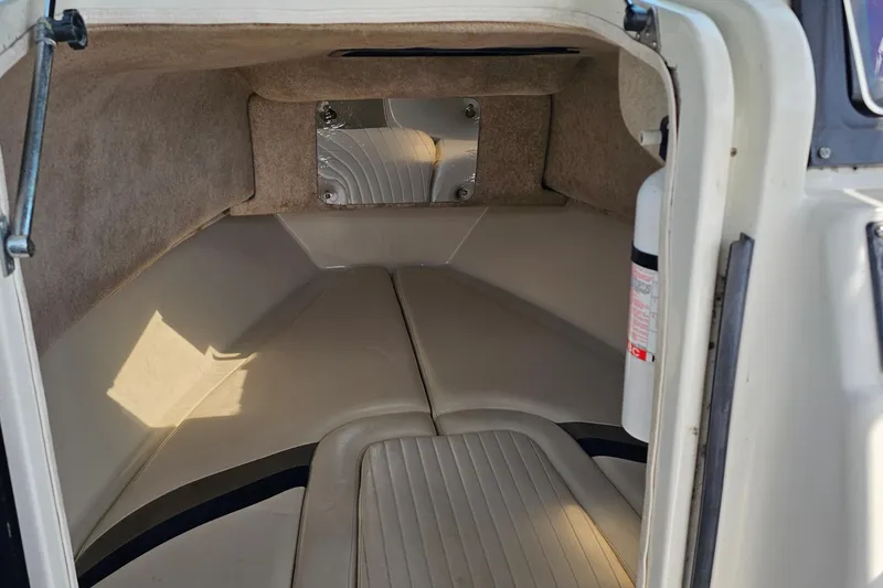 Slide: The Image of Interior cabin of 2003 Caravelle 230 Walk Around Stern Drive boat. - 22