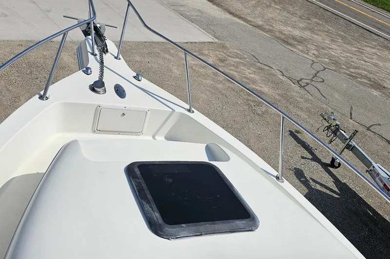 Slide: The Image of Bow view of 2003 Caravelle 230 Walk Around Stern Drive boat on trailer. - 26