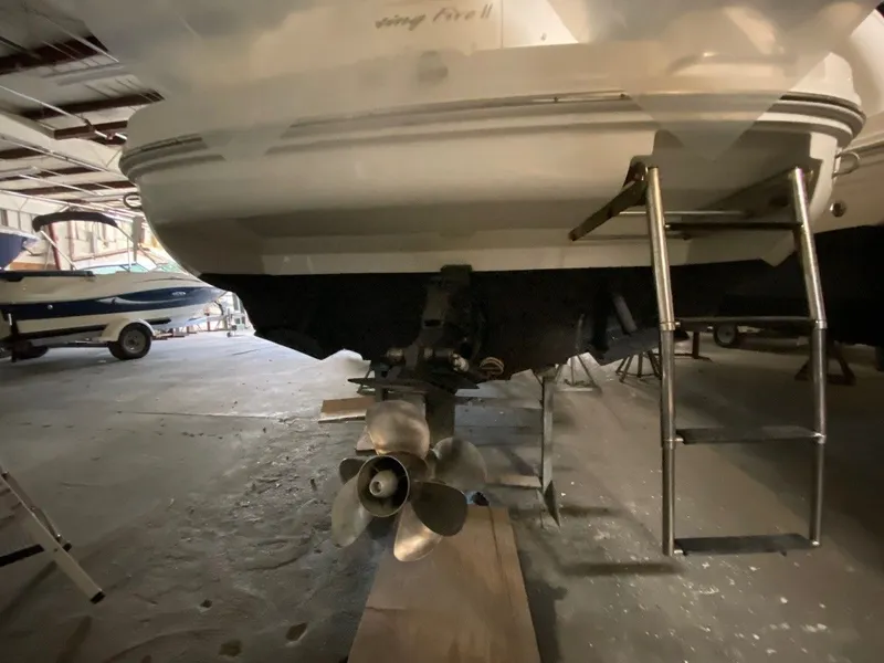 Slide: The Image of Rear view of a 2013 Sea Ray Sundancer 260 in storage. - 2