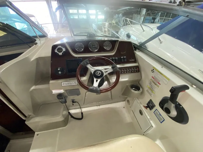 Slide: The Image of Interior view of 2013 Sea Ray Sundancer 260 cockpit. - 3