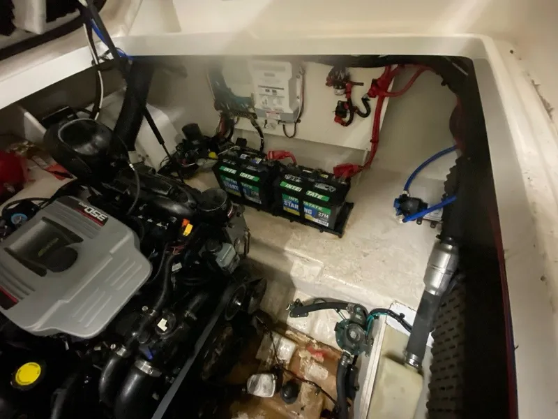 Slide: The Image of Engine compartment of 2013 Sea Ray Sundancer 260 with batteries. - 9