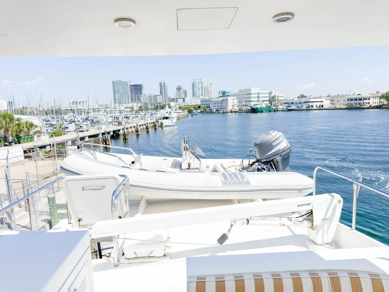 Slide: The Image of Cheoy Lee 68 Motor Yacht 2004 with tender in harbor. - 14