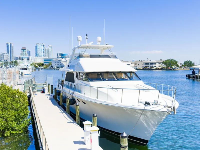 Slide: The Image of Cheoy Lee 68 Motor Yacht 2004 docked with city skyline. - 2