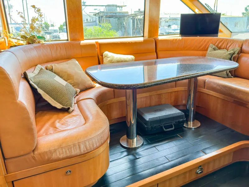 Slide: The Image of Luxurious interior of 2004 Cheoy Lee 68 Motor Yacht with leather seating area. - 20