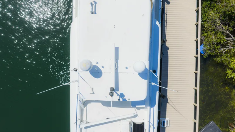 Slide: The Image of Aerial view of a 2004 Cheoy Lee 68 Motor Yacht docked. - 4