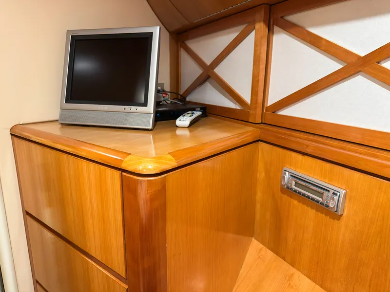 Slide: The Image of Interior of 2004 Cheoy Lee 68 Motor Yacht with TV and wooden cabinets. - 41