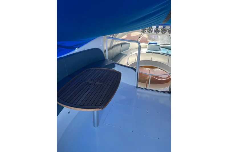 Slide: The Image of Interior view of 2020 Paritetboat Looker with seating and wooden table. - 10