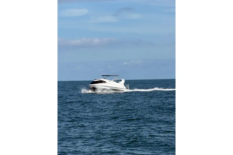 Slide: The Image of 2020 Paritetboat Looker cruising on open sea under clear blue sky. - 16