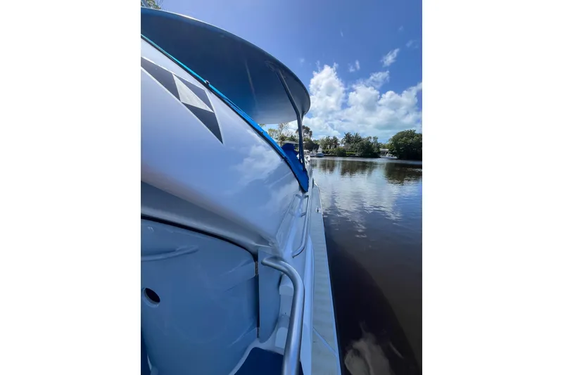 Slide: The Image of 2020 Paritetboat Looker on calm water under a clear blue sky. - 3