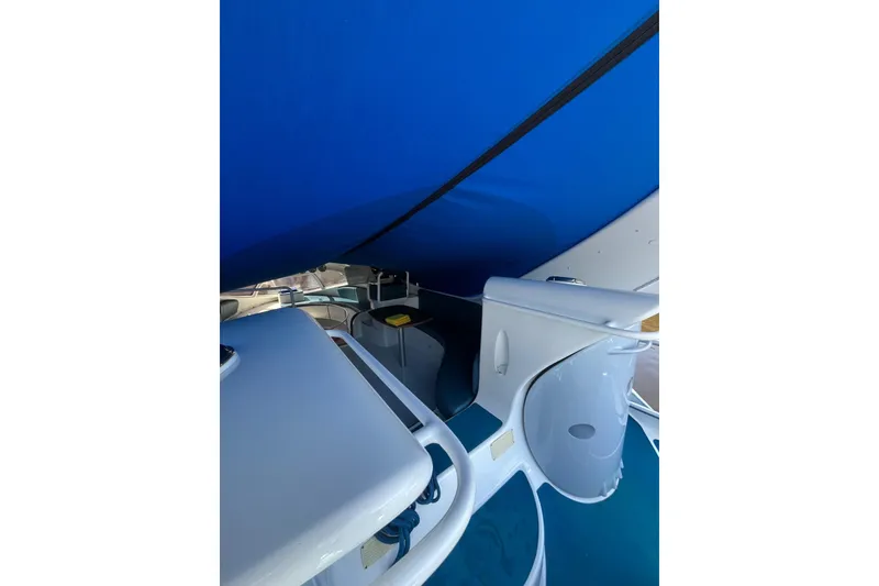 Slide: The Image of Interior view of 2020 Paritetboat Looker with blue canopy and modern design elements. - 5