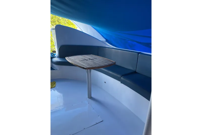 Slide: The Image of Interior of 2020 Paritetboat Looker with seating and wooden table. - 6