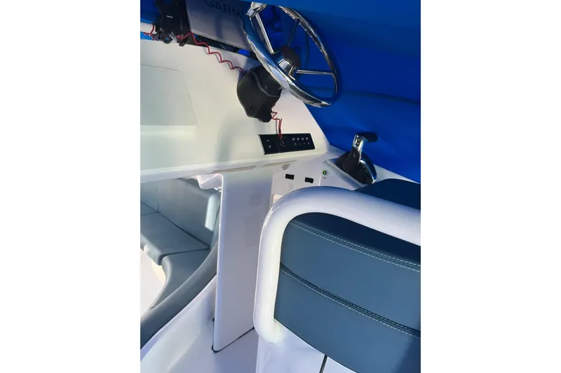 Slide: The Image of Interior of 2020 Paritetboat Looker with steering wheel and controls. - 9