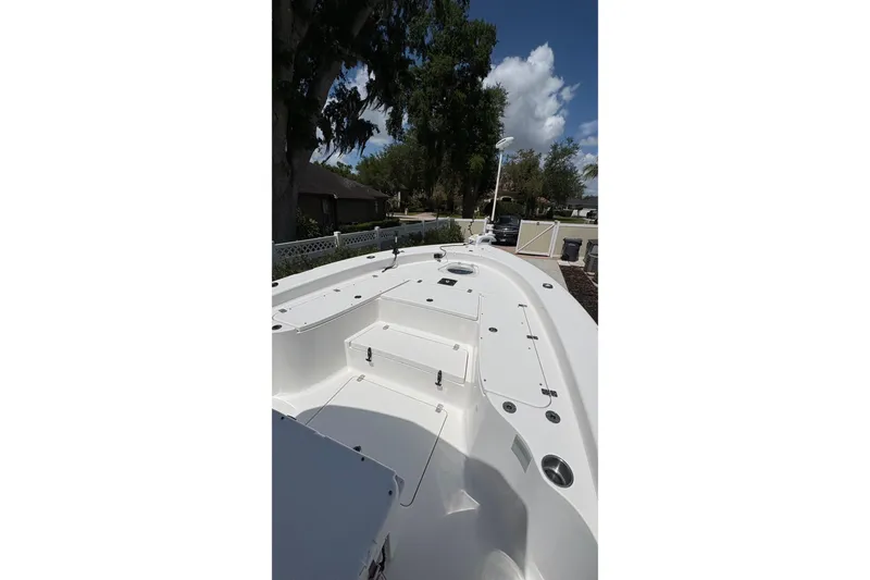 Slide: The Image of 2019 Blue Wave 2800 Pure Hybrid boat deck, featuring spacious layout and storage compartments. - 34