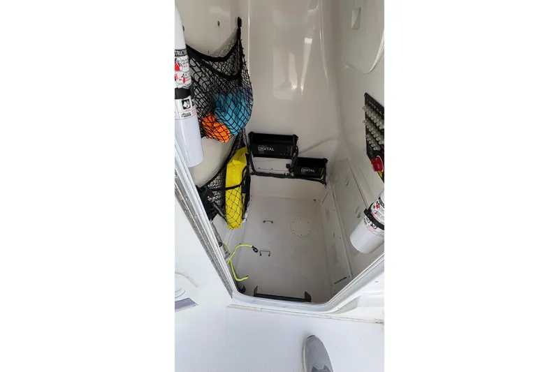 Slide: The Image of Interior storage of 2019 Blue Wave 2800 Pure Hybrid boat with safety equipment. - 38