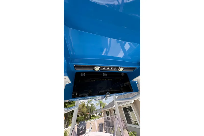 Slide: The Image of 2019 Blue Wave 2800 Pure Hybrid boat console with blue finish and control panel. - 40