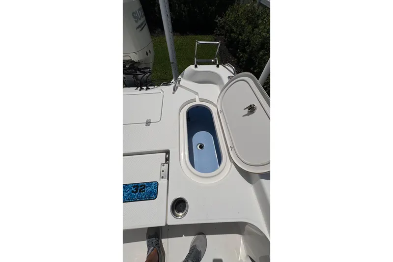 Slide: The Image of 2019 Blue Wave 2800 Pure Hybrid boat deck with open storage compartment. - 43