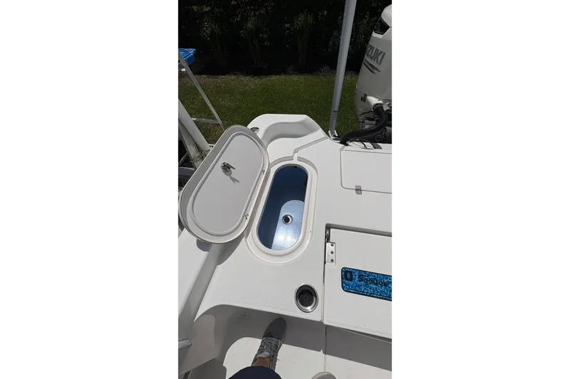 Slide: The Image of 2019 Blue Wave 2800 Pure Hybrid boat deck with open storage compartment. - 44