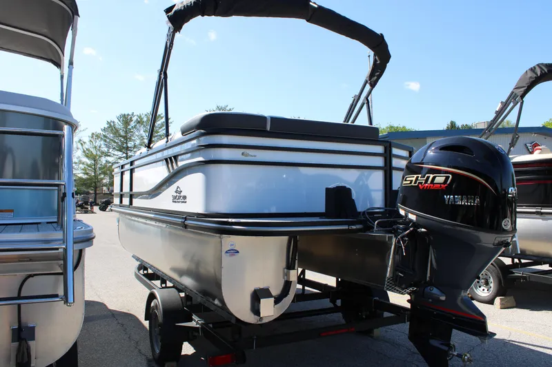 Slide: The Image of 2025 SunCatcher Select 20FC pontoon boat with Yamaha outboard motor on trailer. - 11