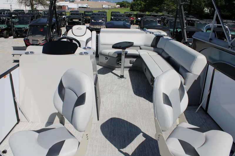 Slide: The Image of 2025 SunCatcher Select 20FC pontoon boat interior with plush seating and modern design. - 12