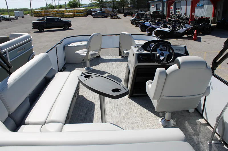 Slide: The Image of Interior of 2025 SunCatcher Select 20FC pontoon boat with seating and steering console. - 14