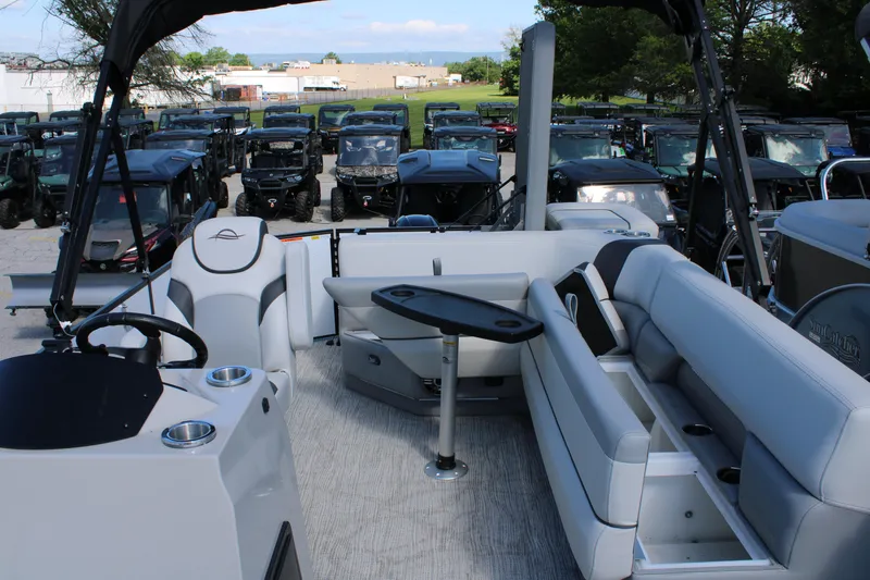 Slide: The Image of Interior of 2025 SunCatcher Select 20FC pontoon boat with seating and steering console. - 17