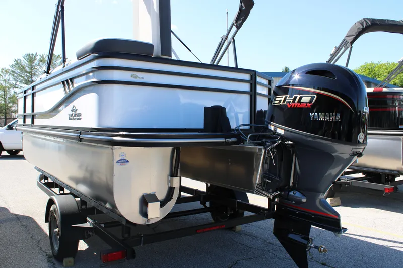 Slide: The Image of 2025 SunCatcher Select 20FC pontoon boat with Yamaha outboard motor on trailer. - 19