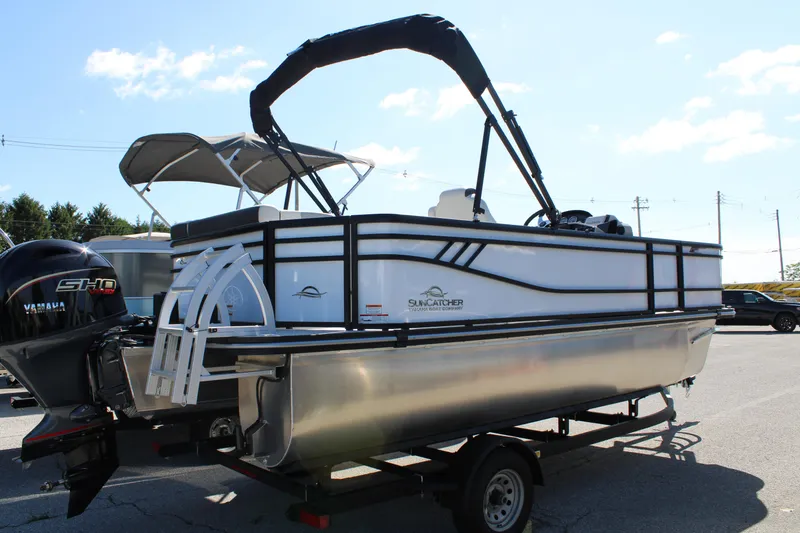 Slide: The Image of 2025 SunCatcher Select 20FC pontoon boat with Yamaha engine on trailer. - 9