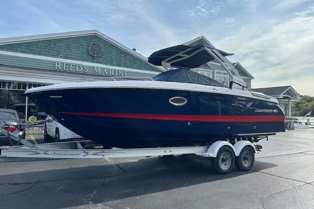 The Image of 2026 Chaparral 6 SSX boat on trailer at Reed's Marine dealership. - 0