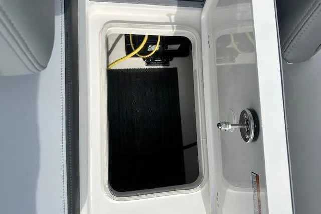 Slide: The Image of Storage compartment in 2026 Chaparral 6 SSX boat, featuring sleek design and utility. - 17