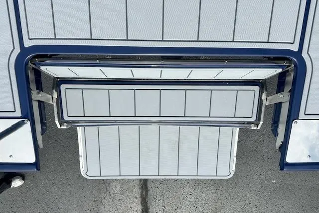Slide: The Image of 2026 Chaparral 6 SSX boat swim platform with sleek, modern design and stainless steel accents. - 21
