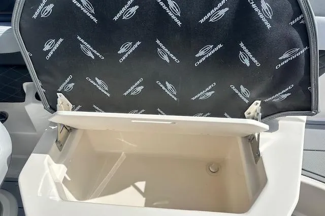 Slide: The Image of 2026 Chaparral 6 SSX storage compartment with branded interior lining. - 25