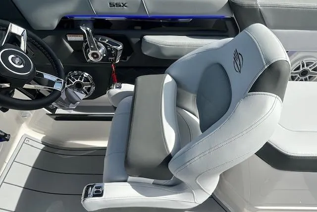 Slide: The Image of 2026 Chaparral 6 SSX boat interior with sleek steering and luxurious seating. - 27