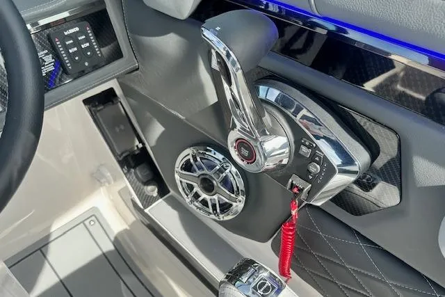 Slide: The Image of Control panel of 2026 Chaparral 6 SSX boat with chrome accents and speaker. - 28