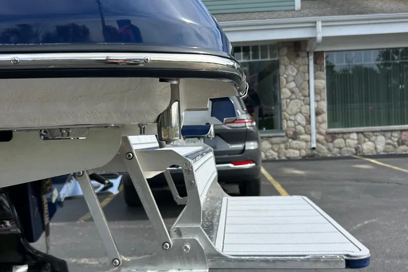 Slide: The Image of 2026 Chaparral 6 SSX boat detail with metal ladder in parking lot. - 4