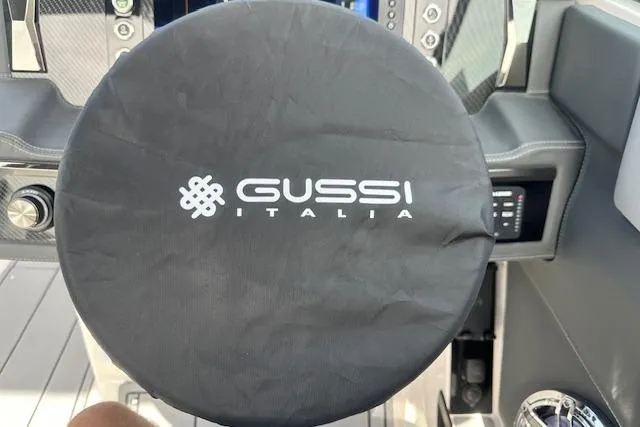 Slide: The Image of Steering wheel cover with "Gussi Italia" logo on 2026 Chaparral 6 SSX boat. - 40