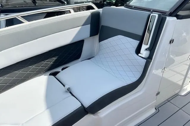 Slide: The Image of 2026 Chaparral 6 SSX boat interior with sleek, modern seating and quilted design. - 42