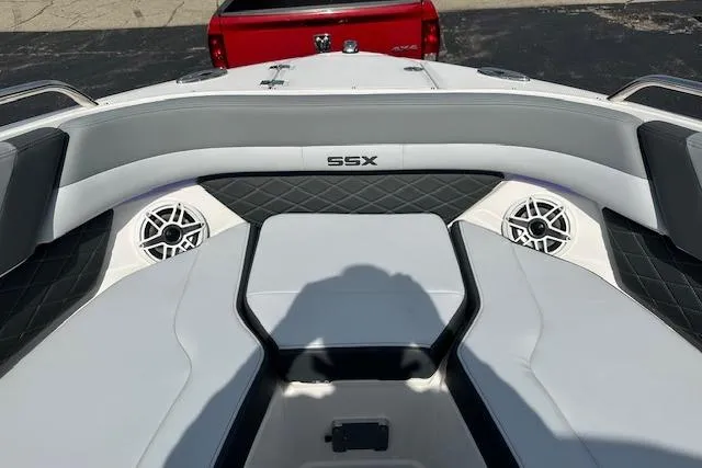Slide: The Image of 2026 Chaparral 6 SSX boat interior with sleek seating and built-in speakers. - 46