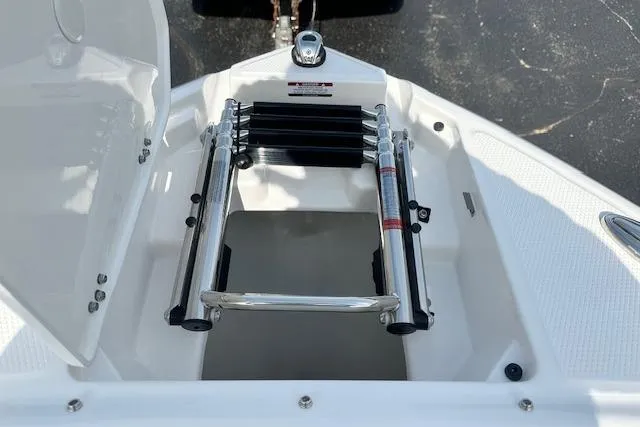 Slide: The Image of Bow ladder compartment on 2026 Chaparral 6 SSX boat, open and ready for use. - 49