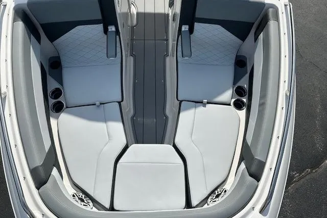 Slide: The Image of 2026 Chaparral 6 SSX boat interior with gray seating and cup holders. - 52