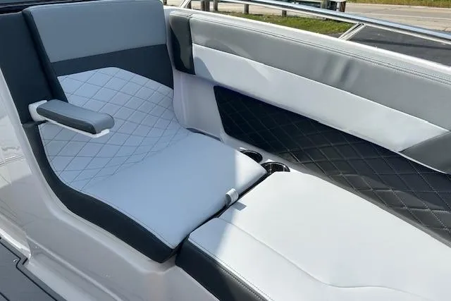 Slide: The Image of 2026 Chaparral 6 SSX boat interior with stylish, quilted seating and modern design. - 53