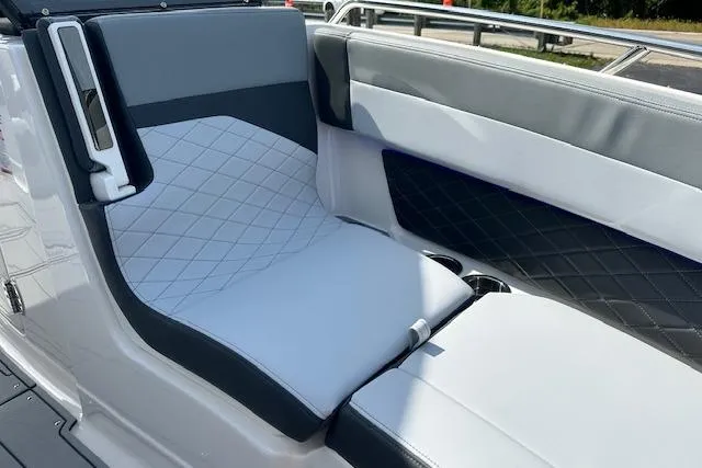 Slide: The Image of 2026 Chaparral 6 SSX boat interior with stylish, diamond-stitched seating and modern design. - 54