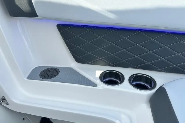 Slide: The Image of Interior of 2026 Chaparral 6 SSX boat with cup holders and quilted paneling. - 56
