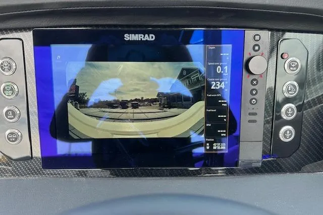 Slide: The Image of Simrad display on 2026 Chaparral 6 SSX boat showing navigation and camera view. - 57