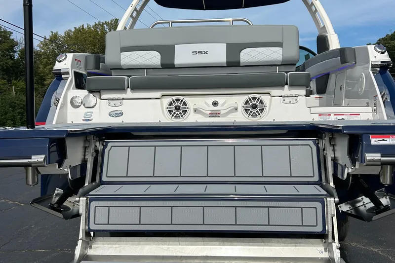 Slide: The Image of 2026 Chaparral 6 SSX boat rear view with swim platform and seating. - 6