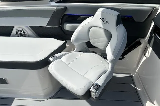 Slide: The Image of Luxury seating on 2026 Chaparral 6 SSX boat, featuring sleek white and gray design. - 60